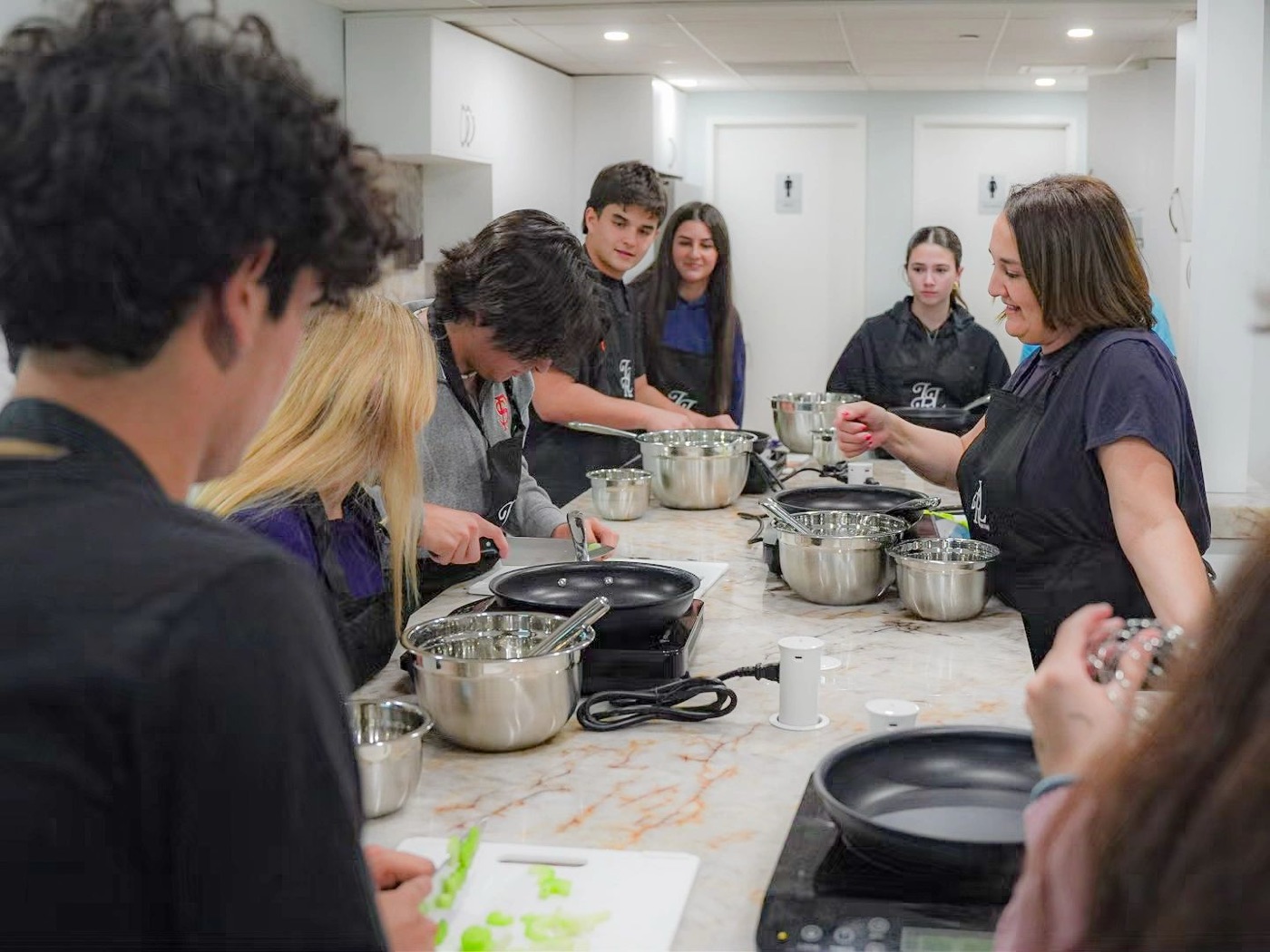 Students cooking together in a Connect group cooking session
