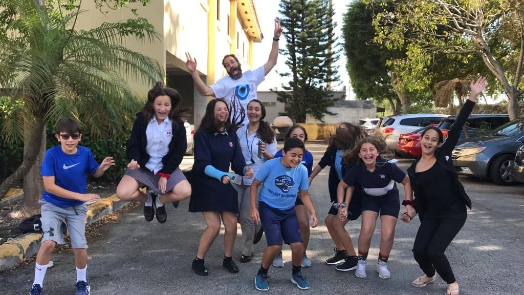 Omar with a youth group outdoors